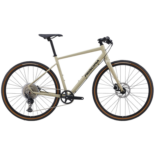 Gravelcykel med ljus sandfärgad ram, skivbromsar och mörka däck