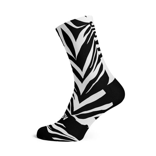 Ass Magic Sox-zebrarandiga strumpor, svarta och vita, höga med V-ränder.