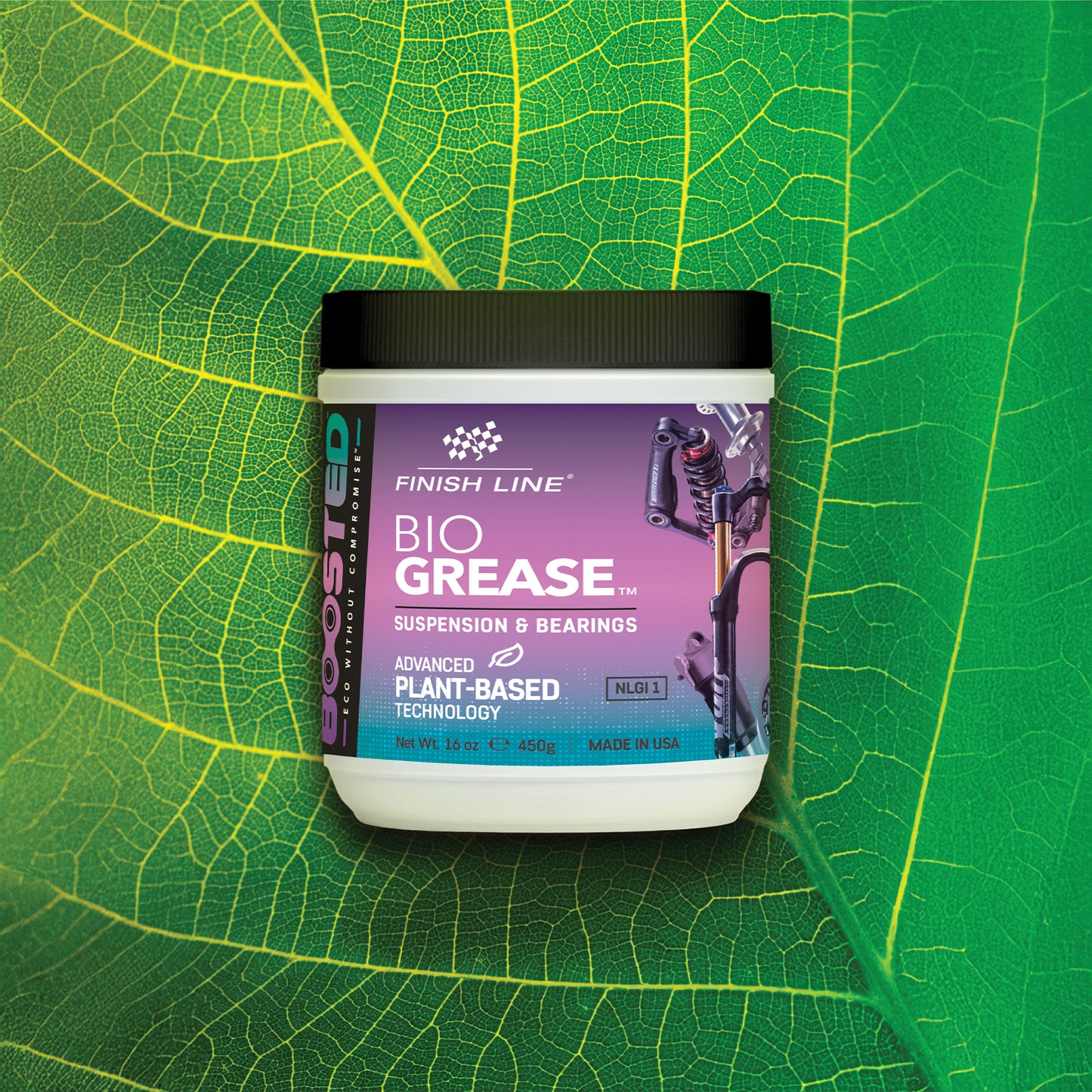 Burk med Finish Line Bio Grease, svart lock och lila etikett på blad.